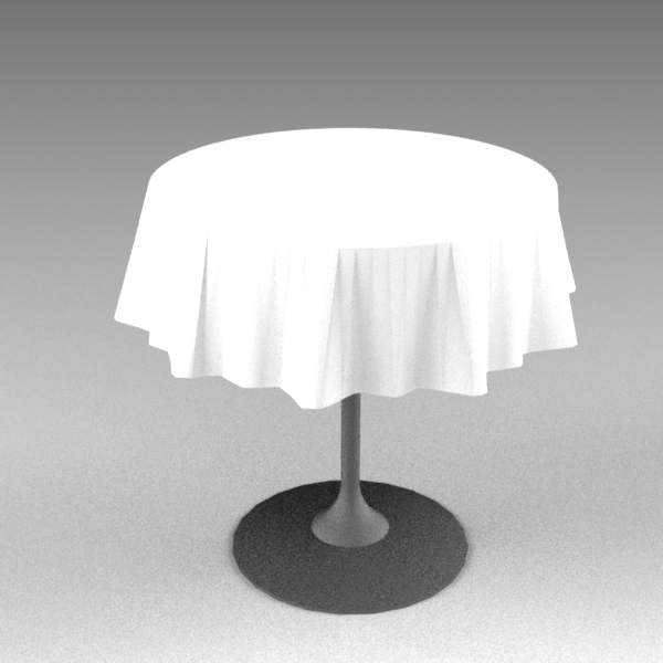 Small cafe table with tablecloth. 