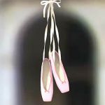 A pair of hanging ballet shoes