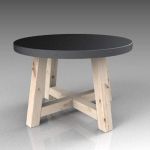 Round wooden table with studded 
metal top. Diame...