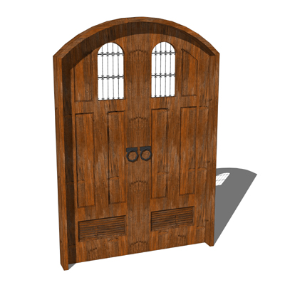 A rustic wood spanish style front door with wrough.... 